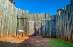 A wood fence at a prison camp.