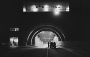 Police officer speaking to the occupant of a car stopped at the entrance of Rays Hill Tunnel