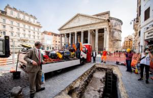 a passerby looks into a sinkhole