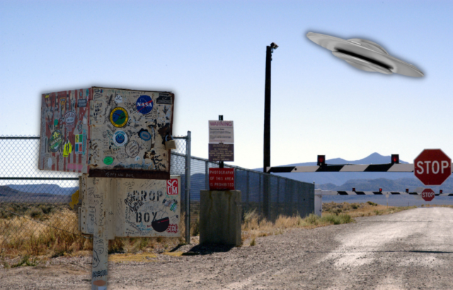 A photo of the gate of Area 51 with a stickered mailbox on top and a UFO in the sky.
