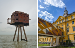 Metal building on stilts in the water, beside a yellow building with a geometrically painted tunnel on pillars.