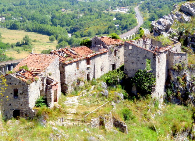 Medieval structures of San Severino di Centola, with the modern villages in the background.
