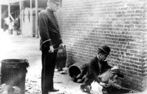 Charlie Chaplin in a still from The Kid (1921)