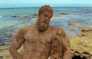 Foreground: Farnese Hercules from the Baths of Caracalla. Background: Sancti Petri coastline, Cadiz, Spain, where the Temple of Hercules Gaditanus stood