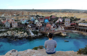 Aerial view of Popeye Village + Robin Williams and Shelley Duvall as Popeye and Olive in 'Popeye