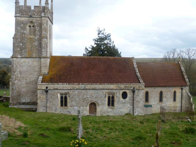 A side view of a stone church.