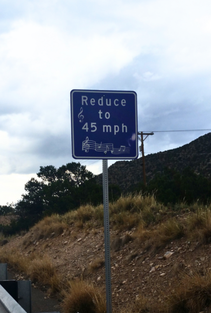 A road sign on a highway.