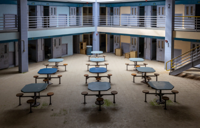 Cafeteria tables and chairs in a correctional facility.