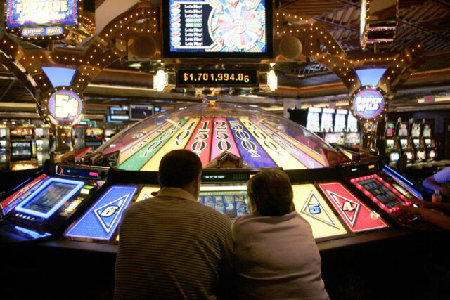 Two people gambling in a casino.