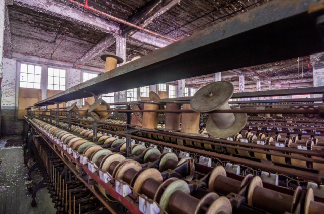 Bobbins on a line at a silk mill.