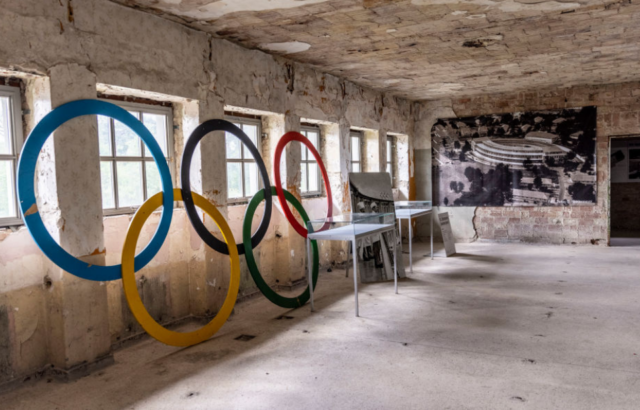 Olympic Games logo placed against a wall within an abandoned building