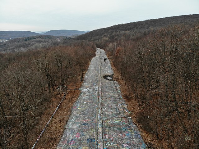 Aerial view of a road covered in graffiti