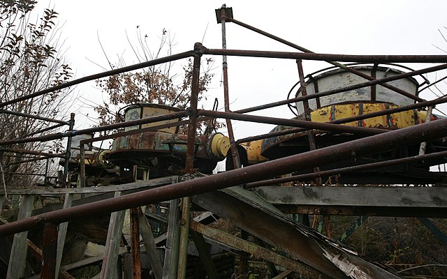 Rusty amusement park ride on an overcast day