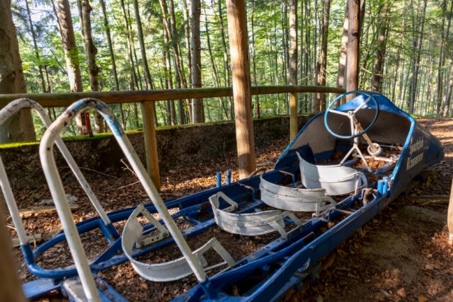 Abandoned bobsleigh in the middle of a forest