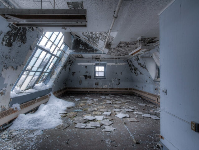 Paper and snow on the floor in the loft of the Hudson River State Hospital