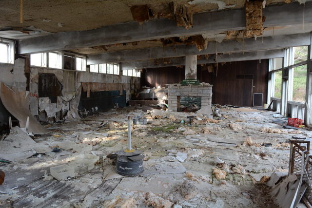 Debris strewn around the remnants of a ski chalet