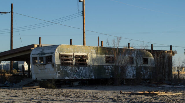 Rusty trailer in the middle of a desert area