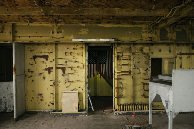 American flag hanging in a doorway aboard the SS United States