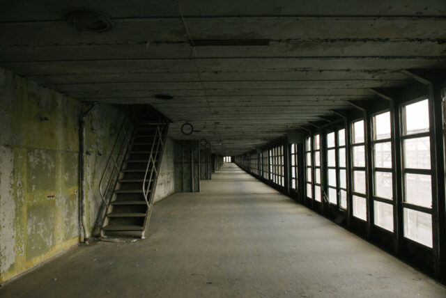 Staircase rising along the side of the wall in the SS United States' promenade