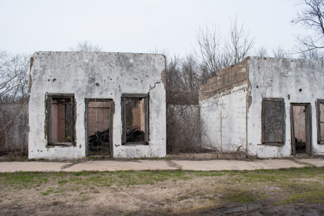 Two homes stripped of everything but bare walls.