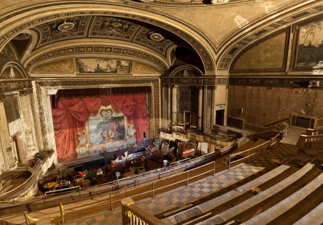 The interior of an abandoned movie theater.