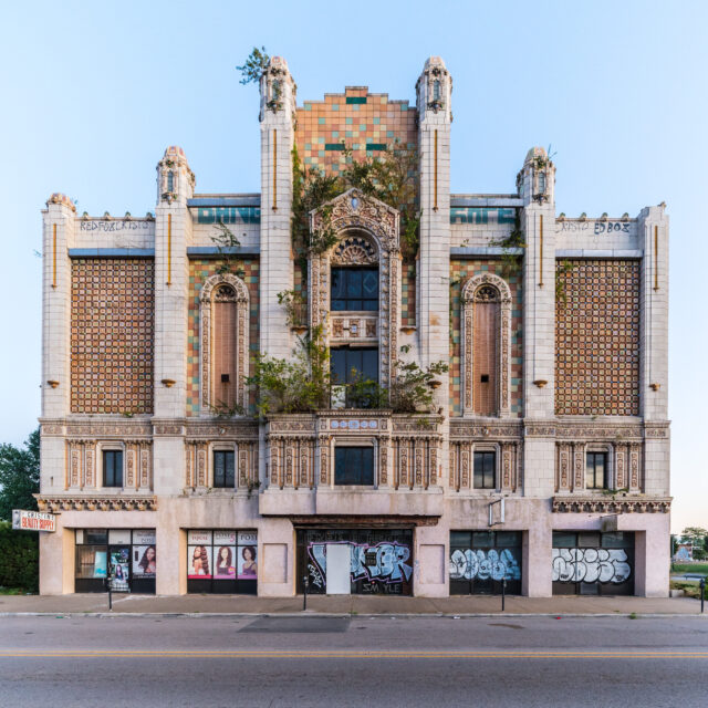 The front of an abandoned theater. 