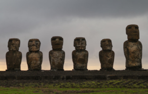 Six Moai statues at dusk