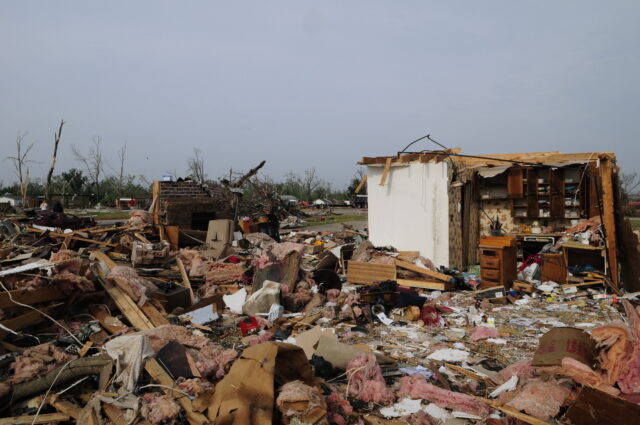 A home severely destroyed by a tornado.