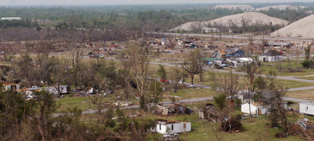 Overview of a town wrecked by a tornado.