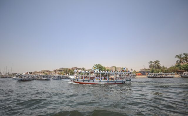 Boats transiting the Nile, near Luxor, Egypt