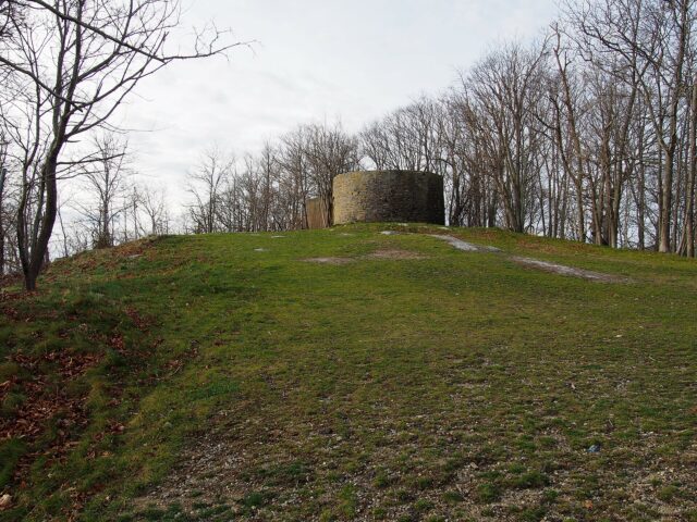 Concrete water tank at the top of a small hill