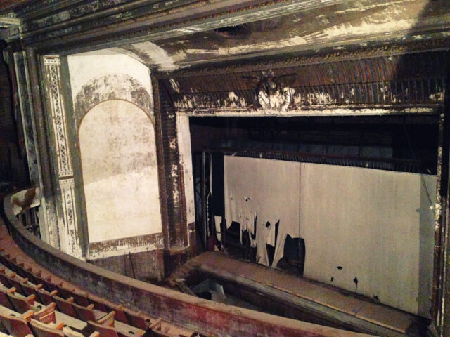 The interior of an abandoned movie theater.