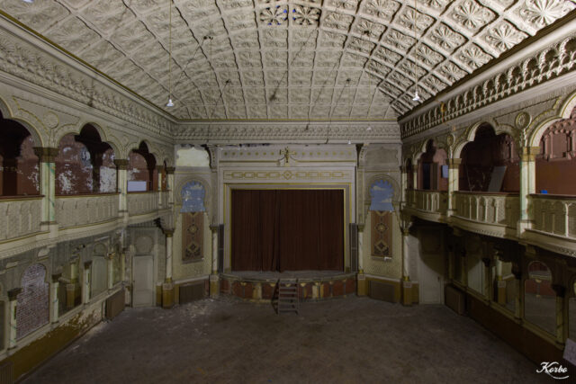 The interior of an abandoned movie theater.