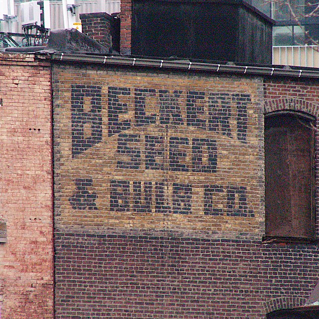 Ghost sign on the exterior of a brick building