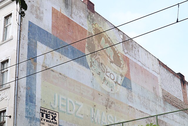 Ghost sign on the exterior of a brick building