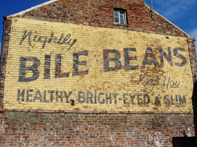 Ghost sign on the exterior of a brick building