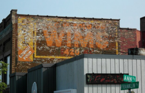 Ghost sign on the exterior of a brick building