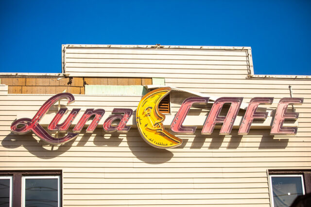 Close-up of the sign on the exterior of the Luna Café