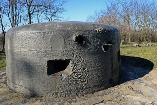 Aboveground bunker dotted with damage