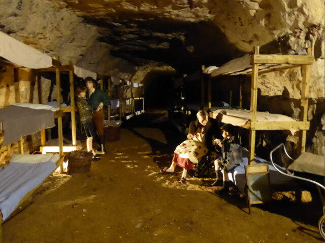 Recreation of how the Chislehurst Caves looked during World War II, with bunk beds along the walls