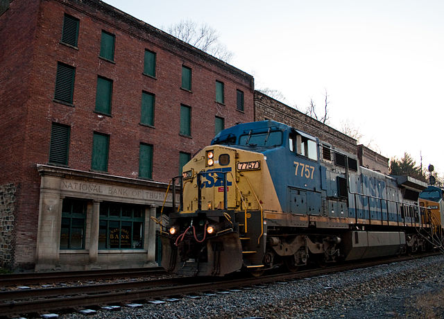 Train transiting past the National Bank in Thurmond, West Virginia