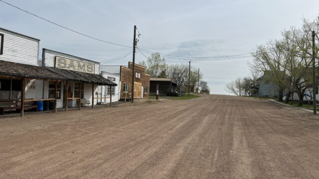 Buildings lining a dirt road