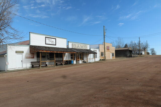 Buildings along a dirt road