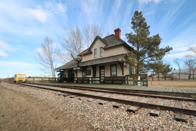 Train station positioned along railway tracks